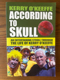The book cover of 'According to Skull' by Kerry O'Keeffe, featuring a dark green top half with bold white and lime green text, a red cricket ball graphic, and a yellow band with black text above a photo of cheering fans in yellow clothing.