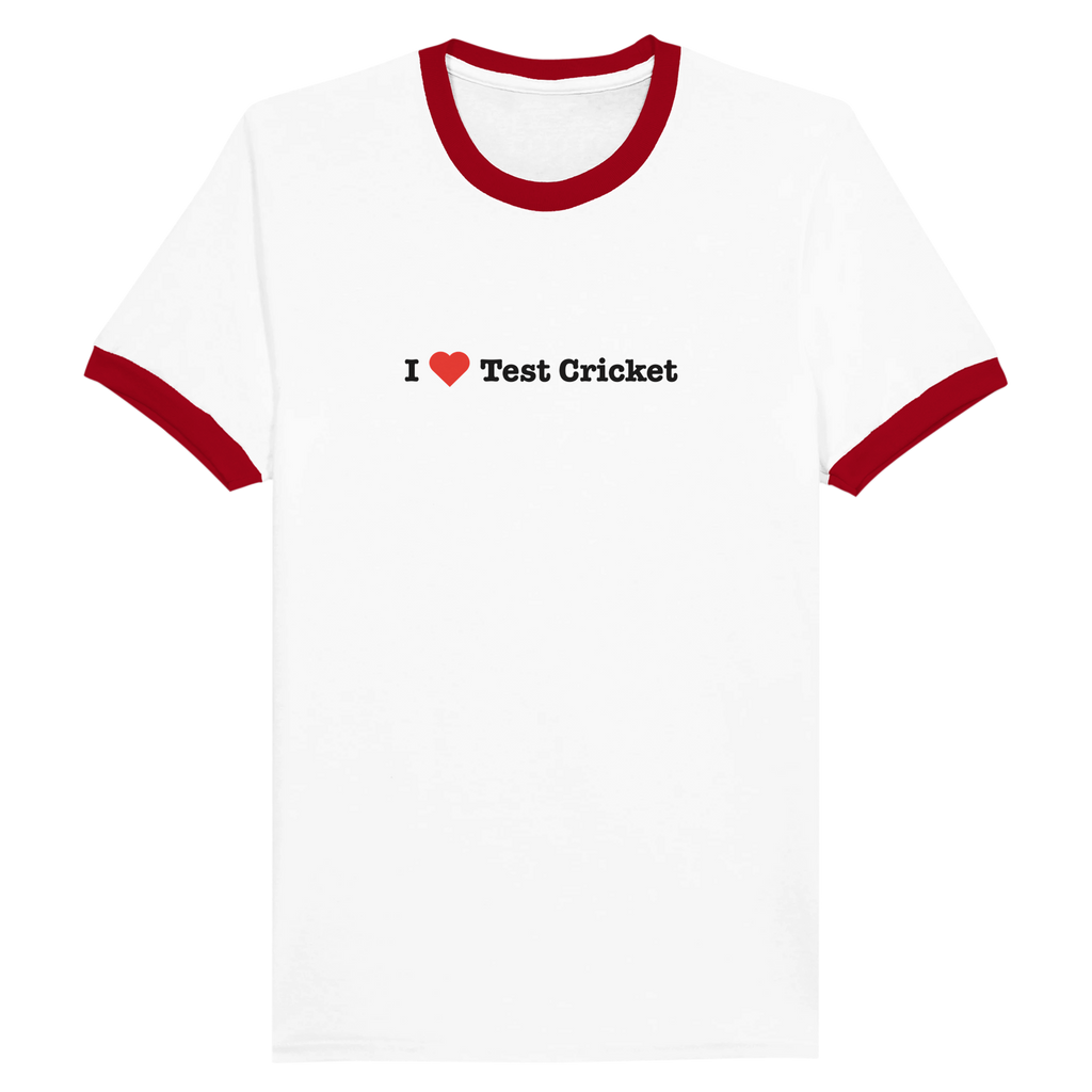 A white ringer t-shirt with red trim on the collar and sleeve cuffs, featuring the text 'I [red heart] Test Cricket' printed in black on the chest.