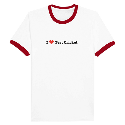 A white ringer t-shirt with red trim on the collar and sleeve cuffs, featuring the text 'I [red heart] Test Cricket' printed in black on the chest.